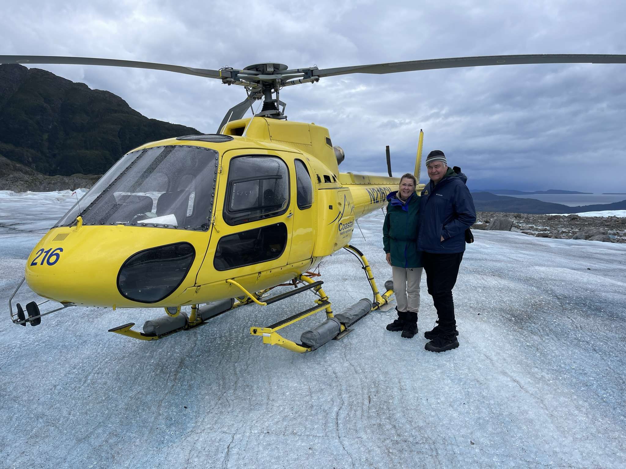 Cos and Robin on glacier with helicopter